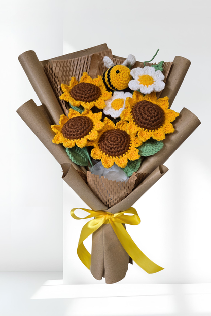 Bouquet of crocheted sunflowers and a bee on a white background
