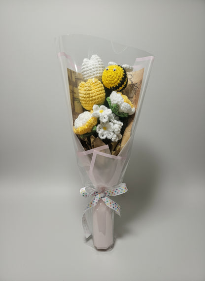 Beautiful bouquet of crocheted flowers with a bee