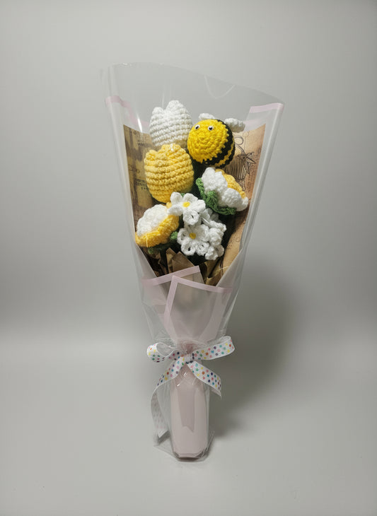 Beautiful bouquet of crocheted flowers with a bee