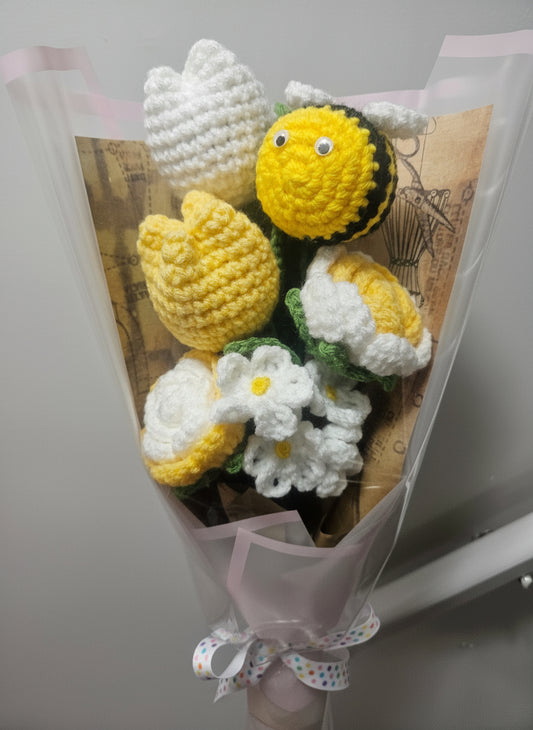 Beautiful bouquet of crocheted flowers with a bee