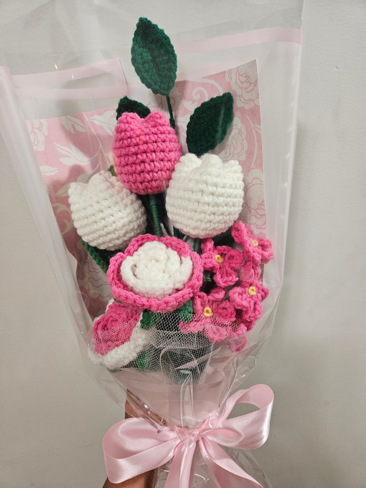 beautiful, handcrafted bouquet features a lovely combination of crocheted pink tulips and roses