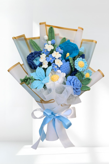 Bouquet of knitted flowers in blue and white on a white background