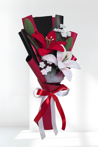 lily bouquet of red and white flowers with a red ribbon on a white background