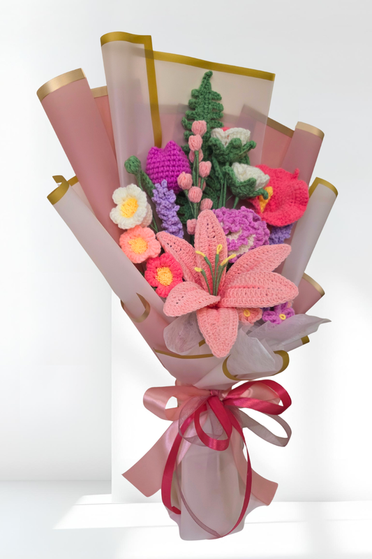 Knitted flower bouquet with pink and green colors on a white background