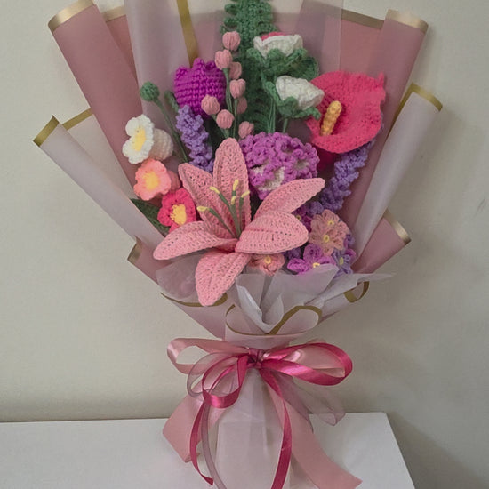 handcrafted crochet flower bouquet features a beautiful mix of lilies, blossoms, and delicate floral accents in soft pastel tones
