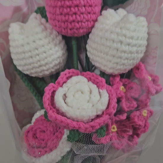 beautiful, handcrafted bouquet features a lovely combination of crocheted pink tulips and roses