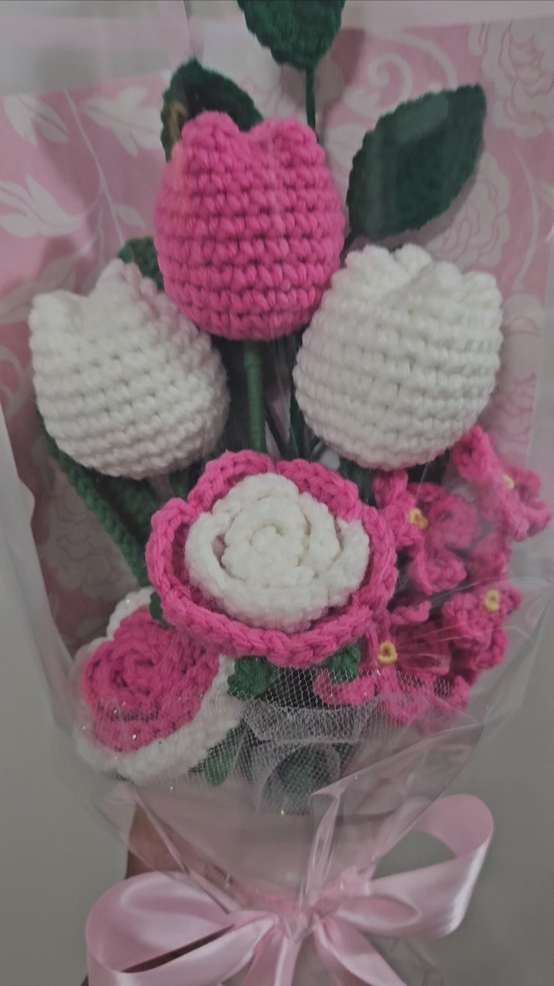 beautiful, handcrafted bouquet features a lovely combination of crocheted pink tulips and roses